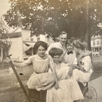          Olive (with hand on wagon handle) with friends on 100-block of Mason St.; Saugatuck House (where Saugatuck Drug is in 2022) is visible at right.
   