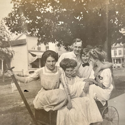Olive (with hand on wagon handle) with friends on 100-block of Mason St.: Saugatuck House (where Saugatuck Drug is in 2022) is visible at right.