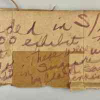          Note scrawled on cardboard box flap packed with group A; Note reads 