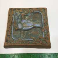 Tile with bird motif