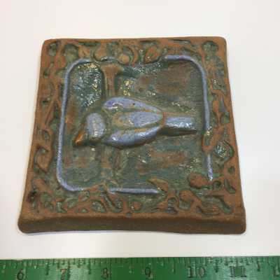 Tile with bird motif