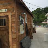          Metal tub, anchor, black and beige hoop nets (under windows)
   
