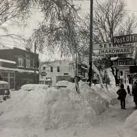          1962 Photo of Butler St taken by Fr Verne Hohl - Left: Restaurant, Dress Shop, Drugstore (Christenson), Fruit Growers State Bank. Right: Post Office, Seymour’s Hardware, Bill’s (Schumacher) Barbershop, Funk’s Newstand
   