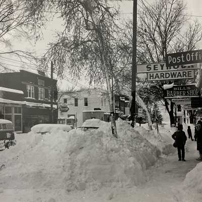 1962 Photo of Butler St taken by Fr Verne Hohl - Left: Restaurant, Dress Shop, Drugstore (Christenson), Fruit Growers State Bank. Right: Post Office, Seymour’s Hardware, Bill’s (Schumacher) Barbershop, Funk’s Newstand