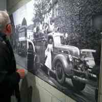         Ken Carls viewing one of the exhibit 'blow up' photos.
   