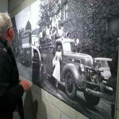 Ken Carls viewing one of the exhibit 'blow up' photos.