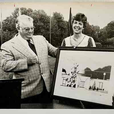 Debbie Hoffman and Don Oyler with High School entrance rendering