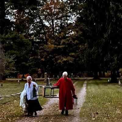 Peg Sanford and Pat Huygey carrying away their props after an evening presenting the life stories of May Francis Heath and Minnie Breuckmann: Event photo posted on facebook by Jackie Ground