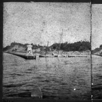 South_pier_light_ca_1895.jpg 692KB: with what looks to be a sunken sailboat in the water