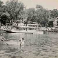          Canoe is in front of Island Queen
   