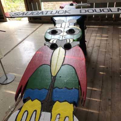 Totem upper section after being repainted May 16 2020 [at boat barn in garden]