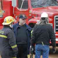          Saugatuck-Douglas Police Chief William Giles, firefighter Mike Block, Saugatuck Township Fire District Chief John Block and gas company worker
   