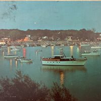 Postcard of the Saugatuck harbor at dusk