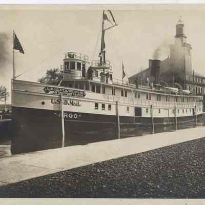 from https://www.worthpoint.com/worthopedia/great-lakes-freighter-steamship-argo-1850762012: Great Lakes Freighter Steamship Argo US Mail Carrier 1900s Antique 8x10 Photo I have acquired a collection of Great Lakes Memorabilia from the Great Lakes Historical Society, and will be listing some of these rare, one of a kind items.This is a photo of the Argo, of the U.S. & D.T. Co. - Booth's Line, Duluth and Port Arthur. It was also used for US Mail transport. The ship was built in 1901 and name was changed to Racine in 1910, so this photo dates between 1901 and 1910. Please note there is a chip of paper missing out of top corner border, and the bottom corner - just the tip - has crease. Also back side has paper stuck to it. See enlarged scans. Actual photo sharper than scans show! Measures 8 x 10 inches.Here is additional information on the Argo:Vessel History Rebuilds : History : Disposition : Last record in 1938, out of Brest, France. Ultimate disposition unknown. Build Information Builder : Craig Ship Building Co. Place Built : Toledo, OH Year Built : 1901 Ownership Changes Owner Date Registry Official Number No owner changes recorded. Name Changes Name Date Registry Official Number RACINE 1910 - 1917 U.S. 107627 RENE 1917 - 1938 FRANCE