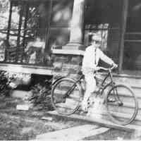          V.H.B. Jr. on bike outside corner house 1926.jpg
   