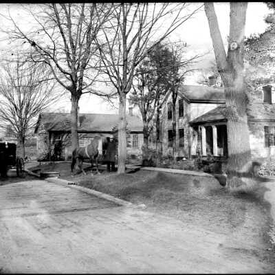 Ma_Pa_horses_again.jpg 2.1MB: man and horse on parkway in front of house