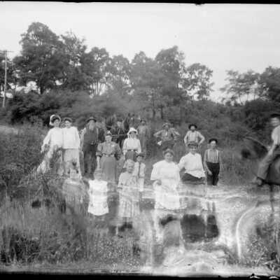 Group_with_team_of_horses.jpg 730KB: group of men, women and children posed by the edge of a waterway. team of horses