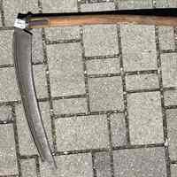          Scythe A has both hand grips
   