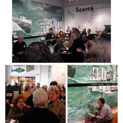 Mu5-25-02c.jpg 152KB: Jim Schmiechen speaks, Dawn Schumann and Sylvia Randolph, Chicora mural artist Randall Higdon touches up the print