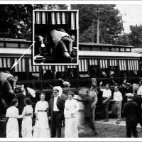          One anxious passenger (inset) boards Interurban through window in 1912 picture.; filename: Interurban crowd ca early 1900s
   