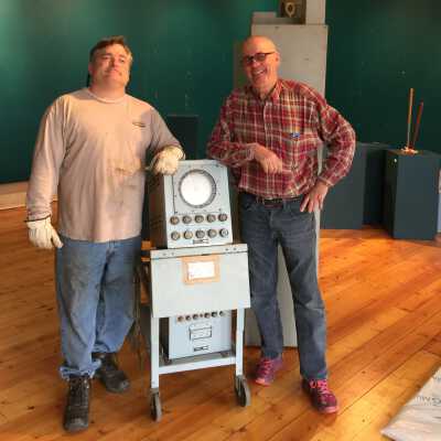Item delivered to museum by two Tower Marine staffers