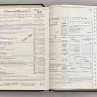          05. Black ledger with tax documents for 1975. 12