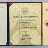          06. Michigan Centennial Business Certificate bestowed Jan. 13, 1977 to Richard Kofsky and other centennial documents in black presentation binder. 11.5