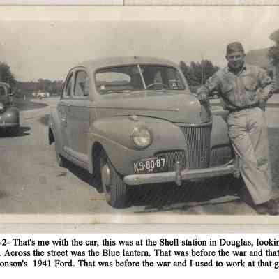 ES1-0010-2HSimonson41Ford-Bud copy.jpg 229KB: That's me with the car, this was at the Shell station in Douglas, looking down at the bridge. Across the street was the Blue lantern. That was before the war and that was Herm Simonson's 1941 Ford. That was before the war and I used to work at that gas station.