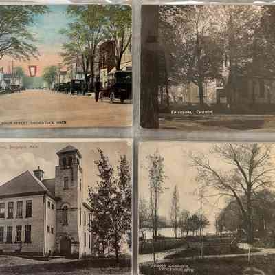 View of Main Street Saugatuck Michigan about 1919 , Episcopal Church , Saugatuck High School around 1915 , Ferry Landing about 1909 Sheet 08: The image shows four vintage postcards depicting scenes from Saugatuck, Michigan.