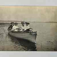 Four people in a rowboat