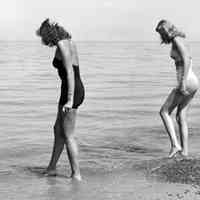         a001 models oval.jpg 2.4MB; 8x10 print in box. Two women in swimsuits, walking in the shallows, testing the waters
   