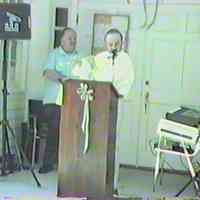          Chuck Lorenz waiting behind Mike Sweeney
   