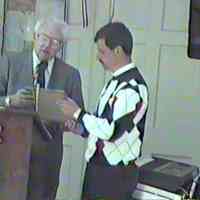          Bob Johnson presents certificate of David Mocini
   