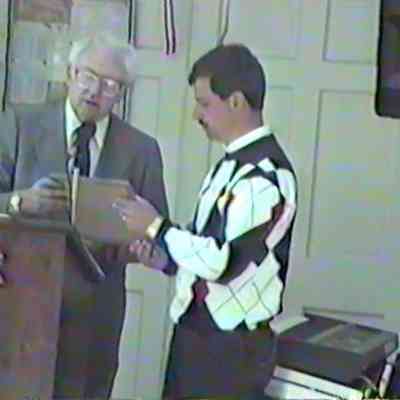 Bob Johnson presents certificate of David Mocini