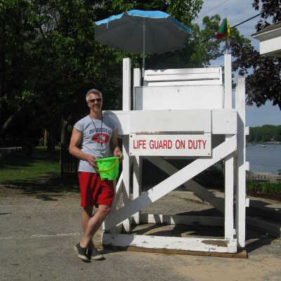 David Lyon as lifeguard for the Summertime opening party
