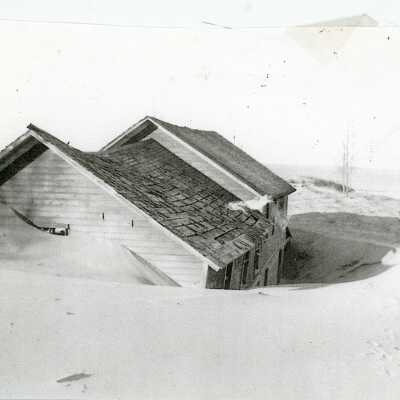"Cover: In the 1920s an occassional roof top emerged as the sands around Singapore blew and shifted.": From "Singapore: The Buried City” by Kit Lane, 1975, page 2