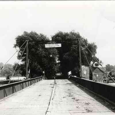 CWPC-0010Bridge.JPG 206KB: Swing bridge with bridge house and sign for People's Store