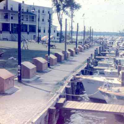 Hotel_Butler_-_dock.jpg 479KB: Grill is visible to the left of the picnic table umbrellas in this view from the boardwalk