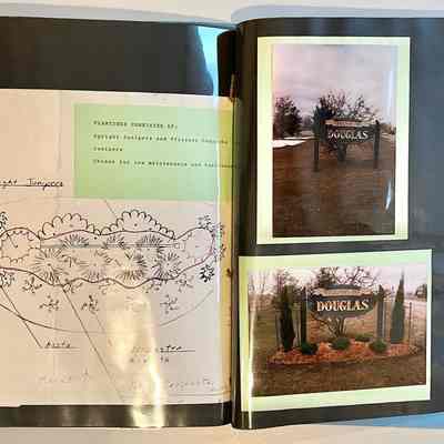1989 Roadside Development No. 20, 56 in blue folder.: Photos, newspaper clipping, letters from Debra L. Bussies and Debra L. Quade Douglas Village Clerk and plan for landscaping two, oval Village of Douglas Signs. The signs were crafted by Bob Krause Sr. One sign was located where Chase Road/Ferry Street meet the Blue Star Highway. The landscaping was executed by Bob Roper and Robert Nava of Roper and Dystra Landscaping.