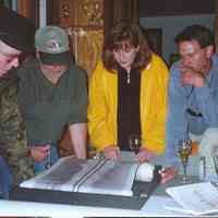          Jan and Dave.jpg 469KB; Search crew Dave Trotter, Craig Rich, Valerie van Heest and Jan Miller review side scan images immediately after Chicora discovery on May 25, 2001. Photo by Lou Spencer
   