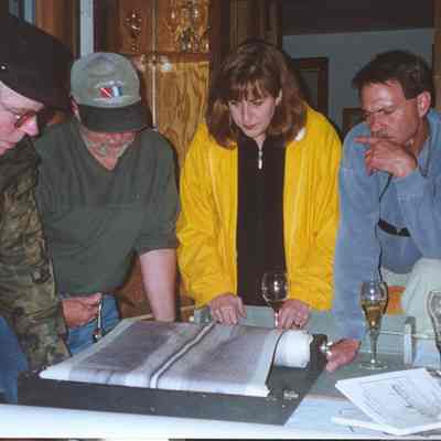 Jan and Dave.jpg 469KB: Search crew Dave Trotter, Craig Rich, Valerie van Heest and Jan Miller review side scan images immediately after Chicora discovery on May 25, 2001. Photo by Lou Spencer