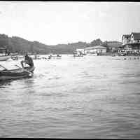          Pavilion_Water_carnival_B.jpg 635KB; Man climbing into dingy
   