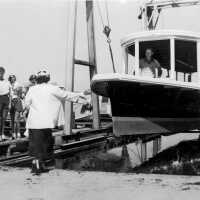          1953 the La Carousel is christened with the Meyers twins and Bonnie Sewers looking on.; Carousel launch 1953
   