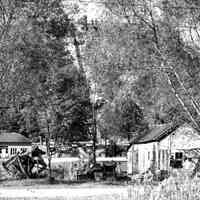          bf015.jpg 2MB; Pump house and Mt. Baldhead stairs with fish gil net drying reels and fishign shanty on Water Street
   