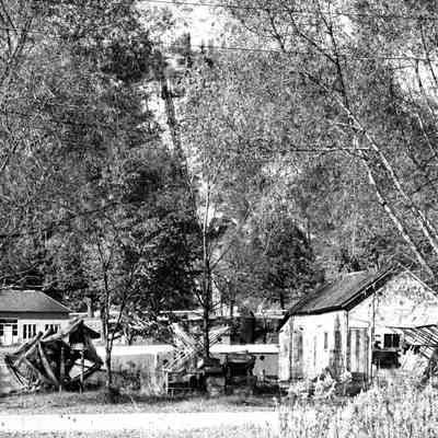 bf015.jpg 2MB: Pump house and Mt. Baldhead stairs with fish gil net drying reels and fishign shanty on Water Street
