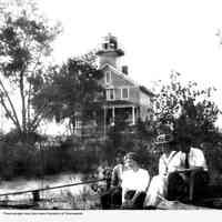          Deam50.jpg 994; Four young people seated near Saugatuck light house. 