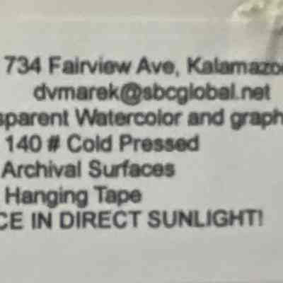 label on the back of the artwork's framing that notes the archival framing materials.
