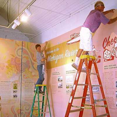 Theresa Agius, Sally Winthers and Mike Zelenka installing the wallpaper: photo by John Peters