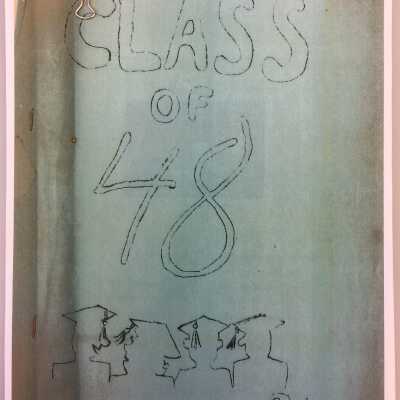 In black binder by yearbooks