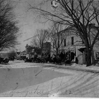 89-1-40 Butler Street no.jpg 512KB: Niles Jewelry shop sign on the side of Leland's Dept. Store. Winter 19?2 with horse-drawn sleighs parked along the street.